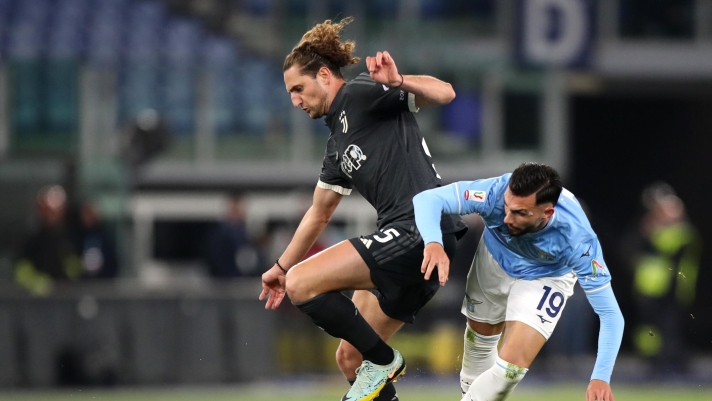 ROME, ITALY - APRIL 23: Adrien Rabiot of Juventus and Valentin Castellanos of SS Lazio battle for possession during the Coppa Italia Semi-final Second Leg match between SS Lazio and Juventus FC at Stadio Olimpico on April 23, 2024 in Rome, Italy. (Photo by Paolo Bruno/Getty Images)
