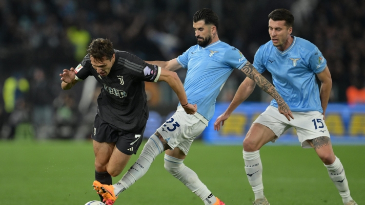 Juventus' Federico Chiesa fights for the ball with Lazio's Elseid Hysaj during the Coppa Italia Semi final (leg 2 of  2)  soccer match between Lazio and Juventus at Rome's Olympic Stadium, Italy - Tuesday, April 23, 2024. Sport - Soccer . (Photo by Alfredo Falcone/LaPresse)