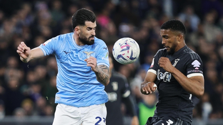Elseid Hysaj of Lazio vies for the ball with Gleison Bremer of Juventus during the Coppa Italia semifinal 2nd leg soccer match between SS Lazio and Juventus FC at Olimpico Stadium in Rome, Italy, 23 April 2024. ANSA/FEDERICO PROIETTI