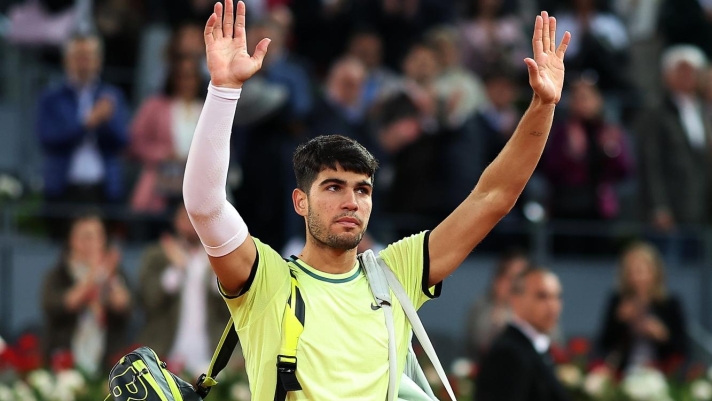 MADRID, SPAIN - MAY 01: Carlos Alcaraz of Spain waves to the crowd after losing his Men?s Singles quarter-final match to Andrey Rublev of Russia on Day Nine of the Muta Madrid Open at La Caja Magica on May 01, 2024 in Madrid, Spain. (Photo by Clive Brunskill/Getty Images)