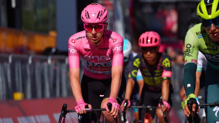 Pink jersey Team UAE's Slovenian rider Tadej Pogacar crosses the finish line of  the 4th stage of the 107th Giro d'Italia cycling race, 190 km between Acqui Terme and Andora, on May 7, 2024 in Andora. (Photo by Luca Bettini / AFP)