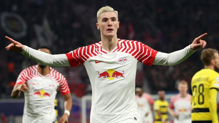 LEIPZIG, GERMANY - DECEMBER 13: Benjamin Sesko of RB Leipzig celebrates after scoring their team's first goal during the UEFA Champions League match between RB Leipzig and BSC Young Boys at Red Bull Arena on December 13, 2023 in Leipzig, Germany. (Photo by Alexander Hassenstein/Getty Images)