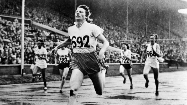 (FILES) Dutch champion Fanny Blankers-Koen crosses the finish line of the 200m event, in Wembley stadium, London, 08 July 1948 where she captured four gold medals,100m, 200m, 80m hurdles and 4x100. During her career, Fanny Blankers-Koen won five European champion titles, 80m hurdles, 4x100m, 100m and 200m from 1946 to 1950. Blankers Koen died 2January 2004 at the age of 85. AFP PHOTO