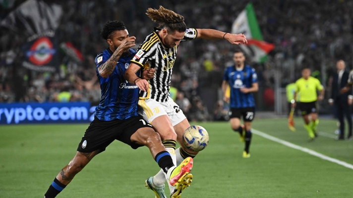 Atalanta's Brazilian midfielder #13 Ederson (L) fights for the ball with Juventus' French midfielder #25 Adrien Rabiot during the Italian Cup Final between Atalanta and Juventus at the Olympic stadium in Rome on May 15, 2024. (Photo by Isabella BONOTTO / AFP)