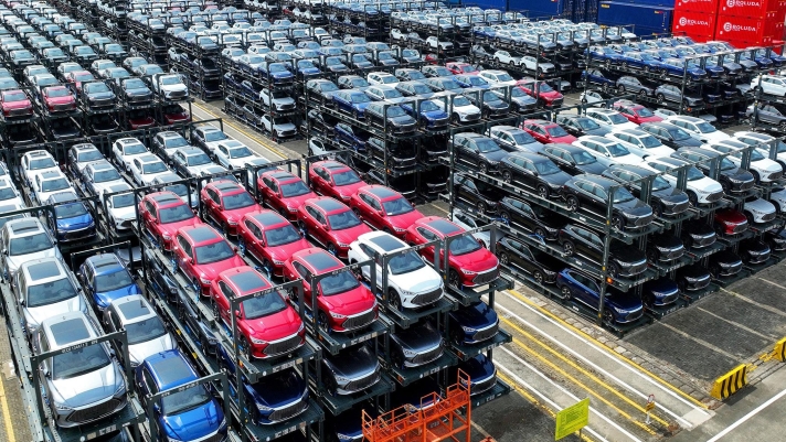 (FILES) This photo taken on September 11, 2023, shows BYD electric cars awaiting to be loaded onto a ship at the international container terminal of Taicang Port at Suzhou Port, in Chinas eastern Jiangsu Province. Struggling foreign automakers in China are looking for help from local tech giants to try and stay competitive in the world's biggest electric car market, where shiny smart screens, assisted driving and sophisticated map technology are in high demand. (Photo by AFP) / China OUT / To go with China-economy-auto-technology-EVs, FOCUS by Peter Catterall and Qasim Nauman
