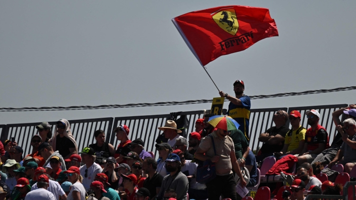 Ferrari's fans cheer during the third practice session at the Autodromo Internazionale Enzo e Dino Ferrari race track in Imola, Italy, on May 18, 2024, ahead of the Formula One Emilia Romagna Grand Prix. (Photo by ANDREJ ISAKOVIC / AFP)