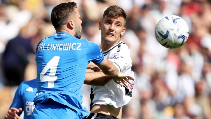 Udinese's Lorenzo Lucca (R) and Empoli's Sebastian Walukiewicz in action during the Italian Serie A soccer match Udinese Calcio vs Empoli FC at the Friuli - Dacia Arena stadium in Udine, Italy, 19 May 2024. ANSA / GABRIELE MENIS