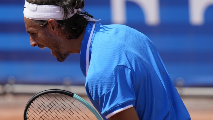 Lorenzo Musetti of Italy reacts after scoring a set point against Taylor Fritz of the United States during their men's singles third round match, at the 2024 Summer Olympics, Wednesday, July 31, 2024, at the Roland Garros stadium in Paris, France. (AP Photo/Andy Wong)