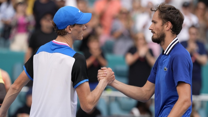 Jannik Sinner, of Italy, left, shakes hands with Daniil Medvedev, of Russia, right, after winning their semifinal match at the Miami Open tennis tournament, Friday, March 29, 2024, in Miami Gardens, Fla. (AP Photo/Lynne Sladky)