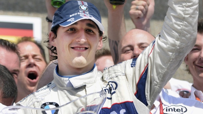 BMW Sauber Formula One driver Robert Kubica, of Poland, celebrates with teammates after winning his first F1 race at the Circuit Gilles-Villeneuve during the Canadian Grand Prix, Sunday, June 8, 2008 in Montreal. (AP Photo/The Canadian Press, Peter McCabe)