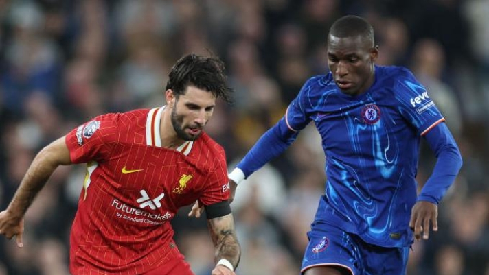 LIVERPOOL, ENGLAND - OCTOBER 20: Dominik Szoboszlai of Liverpool battles for possession with Nicolas Jackson of Chelsea during the Premier League match between Liverpool FC and Chelsea FC at Anfield on October 20, 2024 in Liverpool, England. (Photo by Carl Recine/Getty Images)