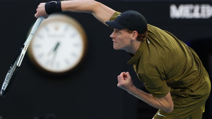 Italy's Jannik Sinner serve to Australia's James Duckworth during their men's singles match on day five of the Australian Open tennis tournament in Melbourne on January 22, 2026. (Photo by DAVID GRAY / AFP) / -- IMAGE RESTRICTED TO EDITORIAL USE - STRICTLY NO COMMERCIAL USE --