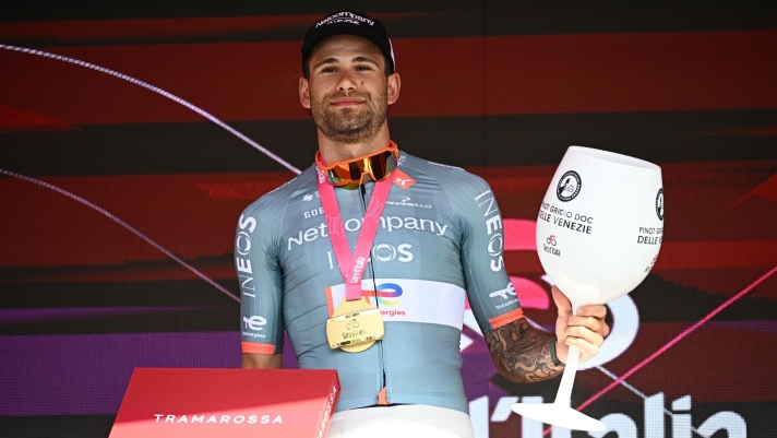 Italian rider Filippo Ganna of Netcompany Ineos Team, poses on the podium after winning the 10th stage of the 109 Giro d'Italia 2026, an individual time trial (ITT) over 42 km from Viareggio to Massa, Italy, 19 May 2026. ANSA/LUCA ZENNARO