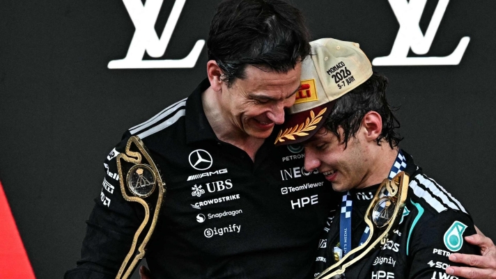 Winner Mercedes' Italian driver Kimi Antonelli (R) celebrates with Mercedes' Austrian team principal and CEO Toto Wolff, who won the constructor trophy, on the podium after competing in Monaco Formula 1 Grand Prix at the Monaco street circuit in Monaco, ahead of the, on June 7, 2026. (Photo by Gabriel BOUYS / AFP)