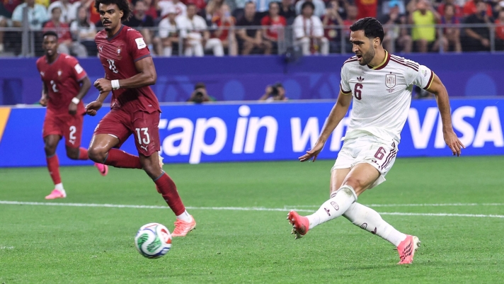 TOPSHOT - Spain's midfielder #06 Mikel Merino scores his team's first goal during the 2026 World Cup round of 16 football match between Portugal and Spain at the Dallas Stadium in Arlington on July 6, 2026. (Photo by Thomas COEX / AFP)