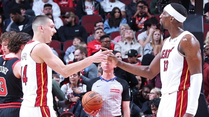  Bam Adebayo #13 of the Miami Heat and Tyler Herro #14 of the Miami Heat shake hands during the game against the Chicago Bulls during the 2025 SoFi Play-In Tournament on April 16, 2025 at United Center in Chicago, Illinois. NOTE TO USER: User expressly acknowledges and agrees that, by downloading and or using this photograph, User is consenting to the terms and conditions of the Getty Images License Agreement. Mandatory Copyright Notice: Copyright 2025 NBAE   Jeff Haynes/NBAE via Getty Images/AFP (Photo by JEFF HAYNES / NBAE / Getty Images / Getty Images via AFP)