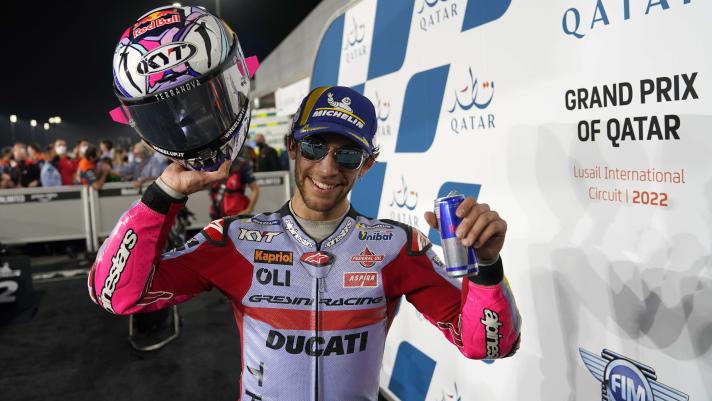 Italian rider Enea Bastianini of the Avintia Esponsorama celebrates victory at Moto GP at the Losail International Circuit in Doha, Qatar, Sunday, March 6, 2022. (AP Photo/Hussein Sayed)