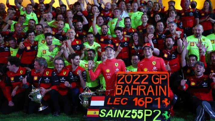 BAHRAIN, BAHRAIN - MARCH 20: Race winner Charles Leclerc of Monaco and Ferrari and Second placed Carlos Sainz of Spain and Ferrari celebrate with their team after the F1 Grand Prix of Bahrain at Bahrain International Circuit on March 20, 2022 in Bahrain, Bahrain. (Photo by Lars Baron/Getty Images)