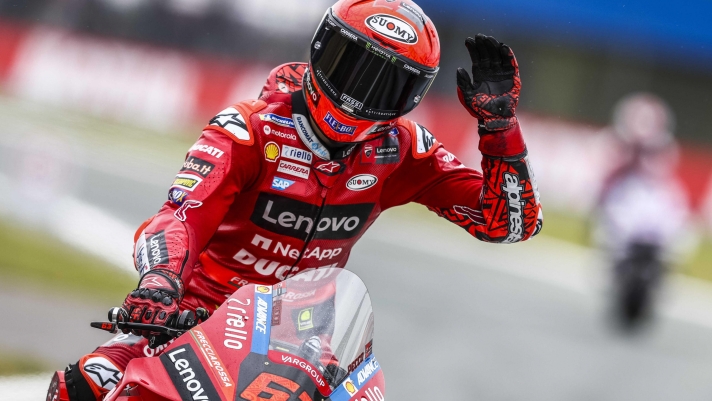 epa10033469 Francesco Bagnaia from Italy on his Ducati celebrates winning the MotoGP qualifying session for the Motorcycling Grand Prix of the Netherlands at the TT circuit of Assen, Netherlands, 25 June 2022.  EPA/Vincent Jannink