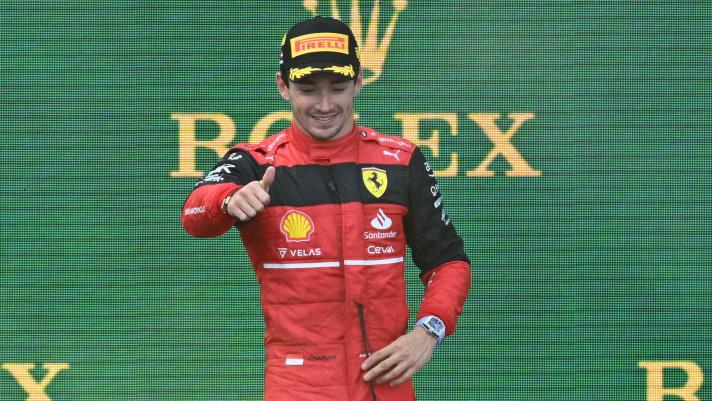 Winner Ferrari's Monegasque driver Charles Leclerc celebrates on the podium after the Formula One Austrian Grand Prix at the Red Bull Ring race track in Spielberg, Austria, on July 10, 2022. (Photo by Joe Klamar / AFP)