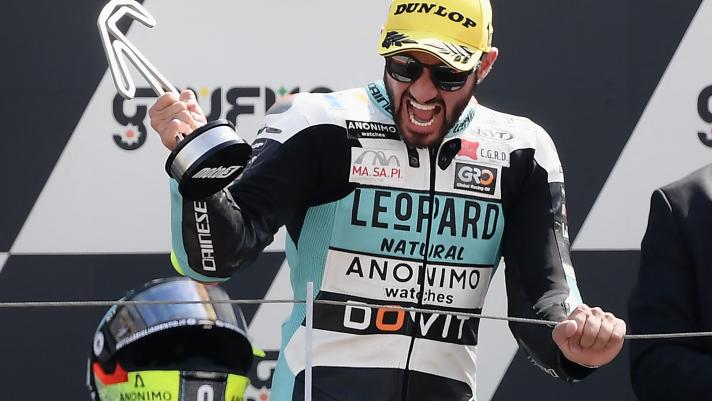 Leopard Racing's Italian rider Dennis Foggia celebrates on the podium during the San Marino Moto3 race at the Misano World Circuit Marco-Simoncelli in Misano Adriatico on September 4, 2022. (Photo by Filippo MONTEFORTE / AFP)