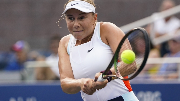 FILE - Amanda Anisimova, of the United States, returns a shot to Yulia Putintseva, of Kazakhstan, during the first round of the US Open tennis championships, Tuesday, Aug. 30, 2022, in New York. The WTA Tour says Anisimova plans to take an indefinite break from tennis after citing burnout and concerns for her mental health.  (AP Photo/Frank Franklin II, File)