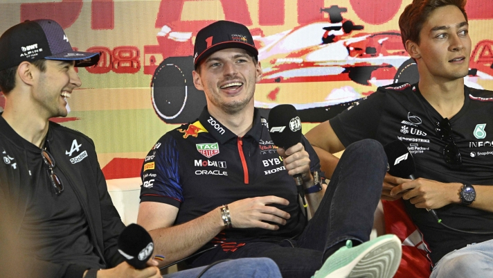 (From L) Alpine's French driver Esteban Ocon, Red Bull Racing's Dutch driver Max Verstappen and Mercedes' British driver George Russell attend a press conference ahead of the Spanish Formula One Grand Prix at the Circuit de Catalunya on June 1, 2023 in Montmelo, on the outskirts of Barcelona. (Photo by JAVIER SORIANO / AFP)