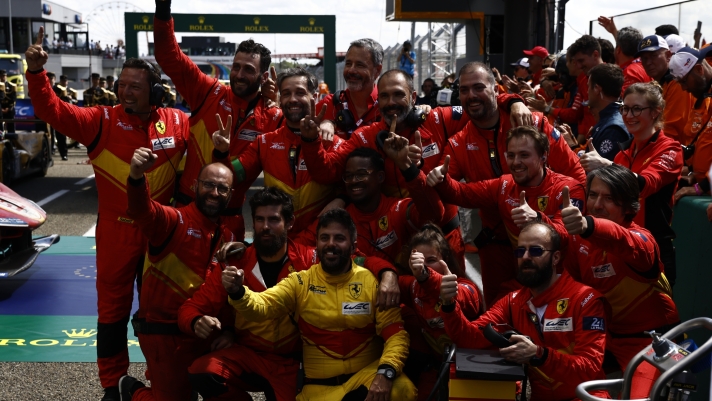 The team of Ferrari AF Corse drivers Antonio Giovinazzi and Alessandro Pier Guidi from Italy and James Calado from Britain celebrate their victory at the 24-hour Le Mans endurance race in Le Mans, western France, Sunday, June 11, 2023. (AP Photo/Jeremias Gonzales)
