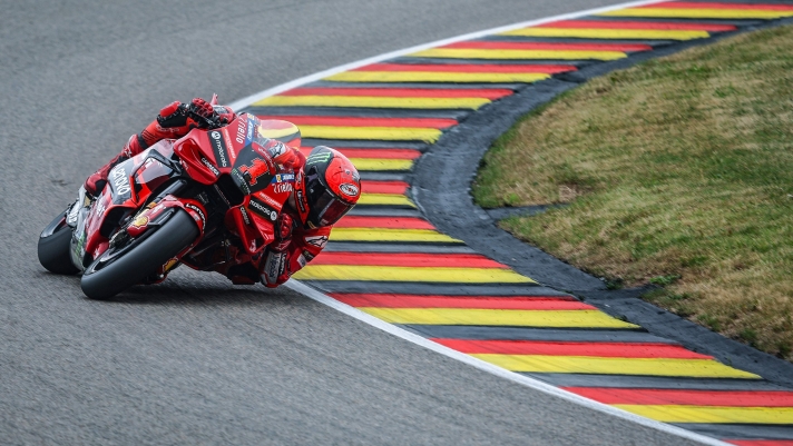 Ducati Lenovo Team's Italian rider Francesco Bagnaia steers his motorbike during the second free practice for the MotoGP German motorcycle Grand Prix at the Sachsenring racing circuit in Hohenstein-Ernstthal near Chemnitz, eastern Germany, on June 16, 2023. (Photo by Ronny Hartmann / AFP)