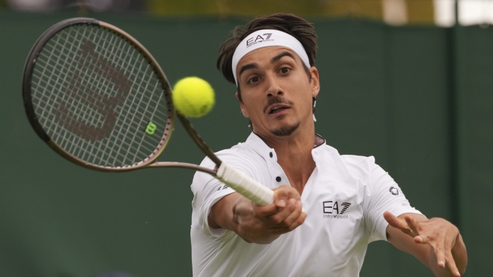Italy's Lorenzo Sonego plays a return to Italy's Matteo Berrettini during the first round men's singles match on day two of the Wimbledon tennis championships in London, Tuesday, July 4, 2023. (AP Photo/Alberto Pezzali)