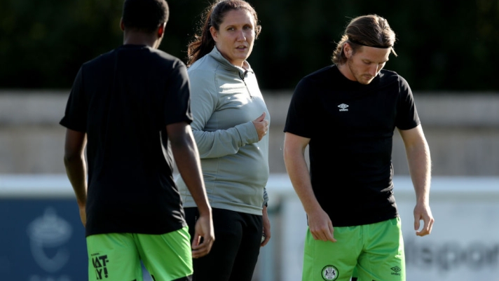 MELKSHAM, ENGLAND - JULY 05: Hannah Dingley, Interim Manager of Forest Green Rovers, speaks with players as they warm up prior to the pre-Season friendly match between Melksham Town and Forest Green Rovers at Oakfield Stadium on July 05, 2023 in Melksham, England. Forest Green Rovers caretaker manager Hannah Dingley becomes first woman to take charge of English Football League club. (Photo by Ryan Hiscott/Getty Images)