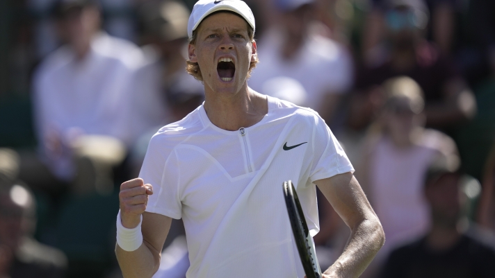 Italy's Jannik Sinner reacts after winning a point against Quentin Halys of France in a men's singles match on day five of the Wimbledon tennis championships in London, Friday, July 7, 2023. (AP Photo/Kin Cheung)
