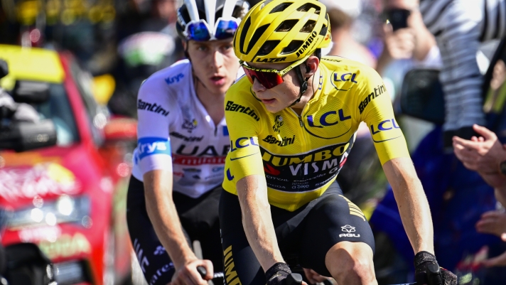 Denmark's Jonas Vingegaard, wearing the overall leader's yellow jersey, and Slovenia's Tadej Pogacar, wearing the best young rider's white jersey, climb Joux Plane pass during the fourteenth stage of the Tour de France cycling race over 152 kilometers (94.5 miles) with start in Annemasse and finish in Morzine Les Portes du Soleil, France, Saturday, July 15, 2023. (Bernard Papon/Pool Photo via AP)