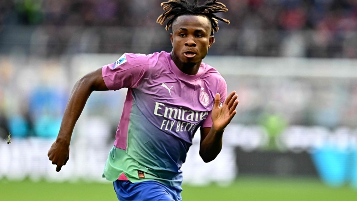AC Milan's Nigerian midfielder #21 Samuel Chukwueze runs for the ball during the Italian Serie A football match between AC Milan and Lecce at San Siro Stadium, in Milan on April 6, 2024. (Photo by GABRIEL BOUYS / AFP)