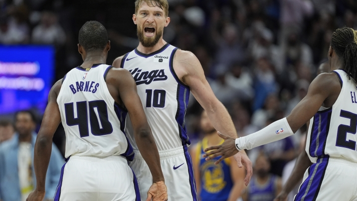 Sacramento Kings forward Domantas Sabonis (10) celebrates with Harrison Barnes (40) during the second half of the team's NBA basketball play-in tournament game against the Golden State Warriors, Tuesday, April 16, 2024, in Sacramento, Calif. (AP Photo/Godofredo A. Vásquez)