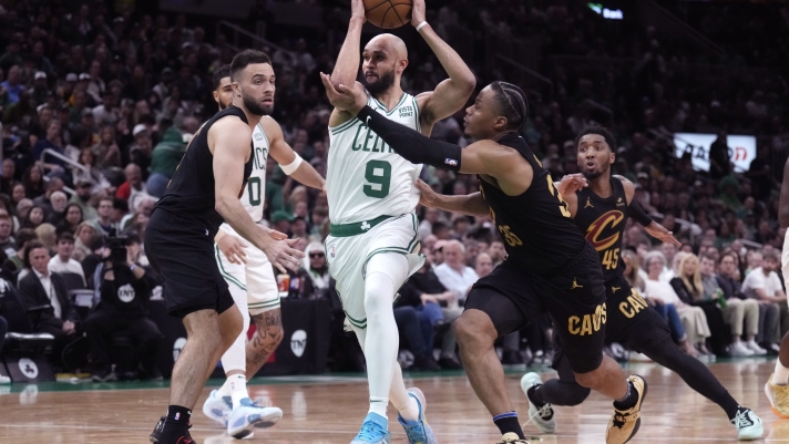 Boston Celtics guard Derrick White (9) drives to the basket against Cleveland Cavaliers forward Isaac Okoro, right, during the second half of Game 1 of an NBA basketball second-round playoff series Tuesday, May 7, 2024, in Boston. (AP Photo/Charles Krupa)