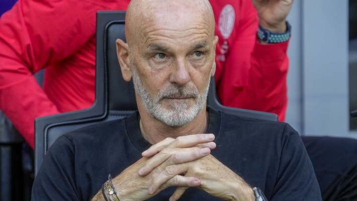 AC Milan's manager Stefano Pioli looks out from the bench prior a Serie A soccer match between AC Milan and Genoa, at the San Siro stadium in Milan, Italy, Sunday, May 5, 2024. (AP Photo/Luca Bruno)