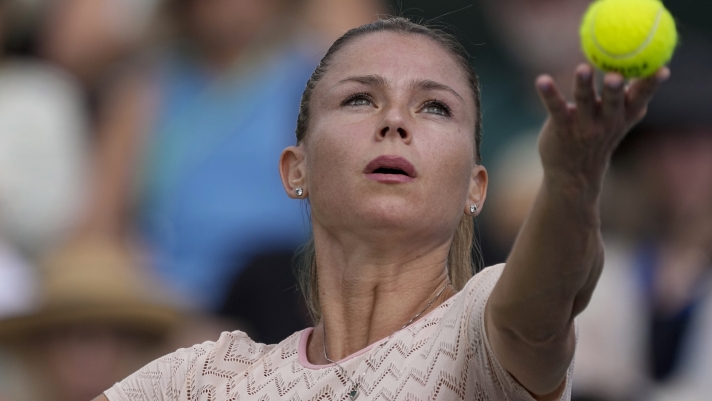 Camila Giorgi, of Italy, serves to Katie Boulter, of Britain, during their match at the BNP Paribas Open tennis tournament Wednesday, March 6, 2024, in Indian Wells, Calif. (AP Photo/Mark J. Terrill)