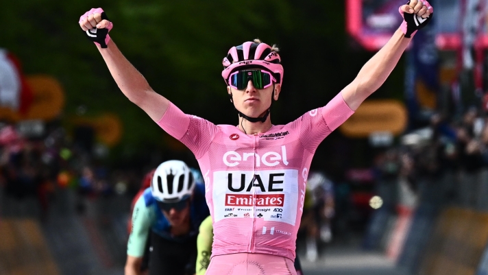 Slovenian rider Tadej Pogacar of  team Uae Emirates wearing the overall leader's pink jersey, celebrates after crossing the finish line and win the 8th stage of the 107 Giro d'Italia 2024, cycling race over 152 km from Spoleto to Prati di Tivo, Italy, 11 May 2024. ANSA/LUCA ZENNARO