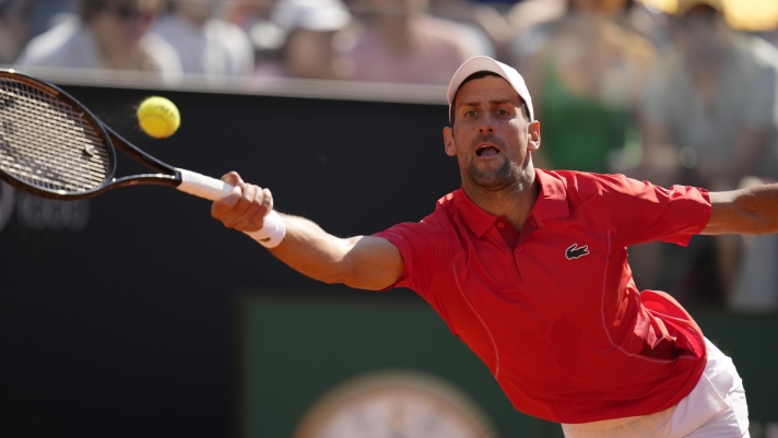 Serbia's Novak Djokovic returns the ball to Chile's Alejandro Tabilo at the Italian Open tennis tournament in Rome, Sunday, May 12, 2024. (AP Photo/Alessandra Tarantino)