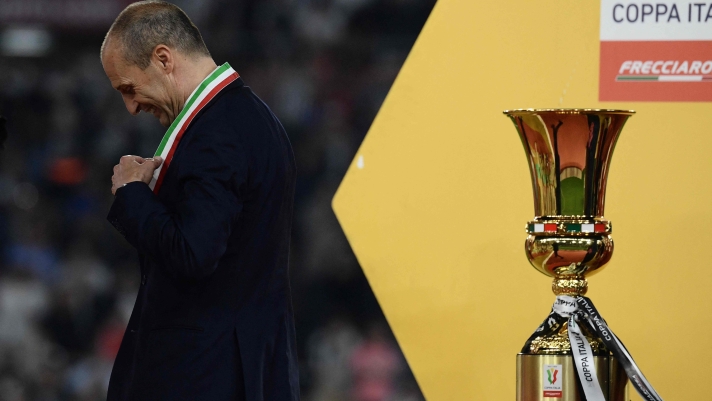 Juventus' Italian coach Massimiliano Allegri adjusts his medal after winning the Italian Cup Final between Atalanta and Juventus at the Olympic stadium in Rome on May 15, 2024. (Photo by Filippo MONTEFORTE / AFP)