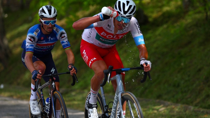 Team Soudal-Quick Step's French rider Julian Alaphilippe (L) and Team Polti-Kometa's Italian rider Mirco Maestri climb during the 12th stage of the 107th Giro d'Italia cycling race, 193km between Martinsicuro and Fano, on May 16, 2024. (Photo by Luca Bettini / AFP)