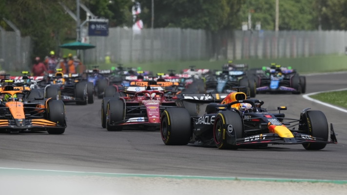 Red Bull driver Max Verstappen of the Netherlands, right, leads the field after the start during the Italy's Emilia Romagna Formula One Grand Prix race at the Dino and Enzo Ferrari racetrack in Imola, Italy, Sunday, May 19, 2024. (AP Photo/Antonio Calanni)
