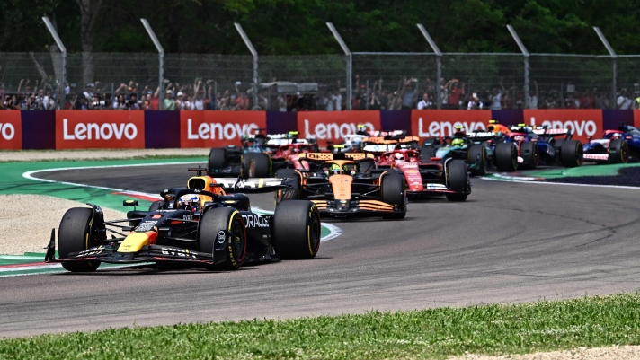 Red Bull Racing's Dutch driver Max Verstappen and the pack take a corner during the Emilia Romagna Formula One Grand Prix at the Autodromo Enzo e Dino Ferrari race track in Imola on May 19, 2024. (Photo by GABRIEL BOUYS / AFP)