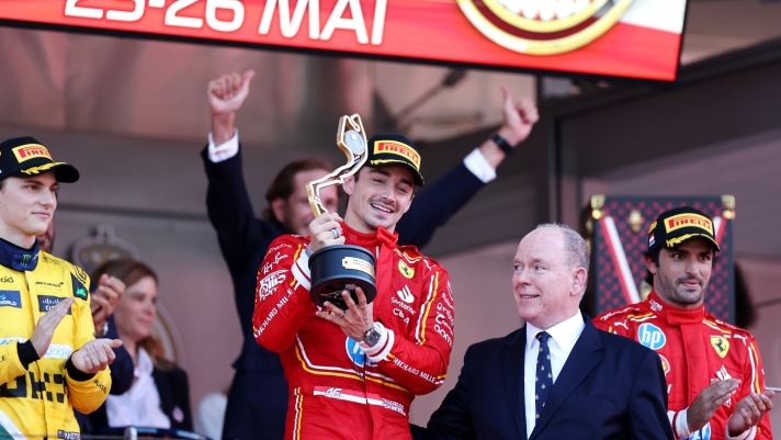 MONTE-CARLO, MONACO - MAY 26: Race winner Charles Leclerc of Monaco and Ferrari celebrates with Prince Albert of Monaco on the podium during the F1 Grand Prix of Monaco at Circuit de Monaco on May 26, 2024 in Monte-Carlo, Monaco. (Photo by Ryan Pierse/Getty Images)