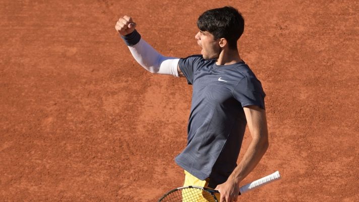 Spain's Carlos Alcaraz celebrates after a point as he plays against Germany's Alexander Zverev during their men's singles final match on Court Philippe-Chatrier on day fifteen of the French Open tennis tournament at the Roland Garros Complex in Paris on June 9, 2024. (Photo by Bertrand GUAY / AFP)