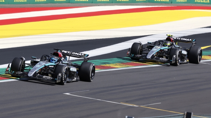Mercedes driver George Russell of Britain, left, leads ahead of Mercedes driver Lewis Hamilton of Britain as they steer their cars during the Formula One Grand Prix at the Spa-Francorchamps racetrack in Spa, Belgium, Sunday, July 28, 2024. (AP Photo/Geert Vanden Wijngaert)