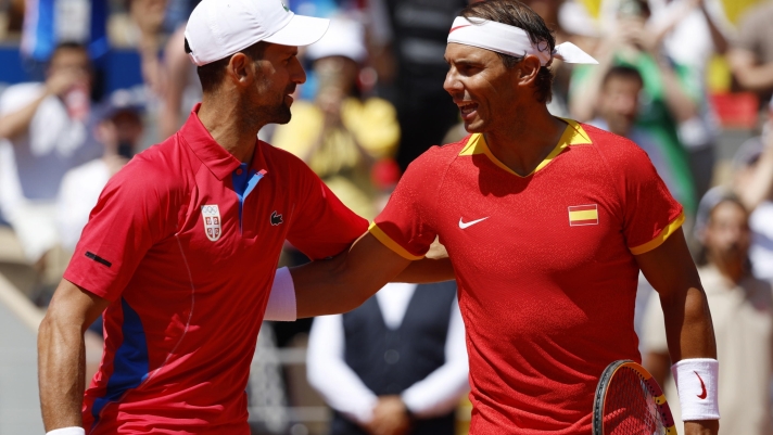 epaselect epa11505548 Rafael Nadal (R) of Spain and Novak Djokovic of Serbia greet each other ahead of their Men's Singles second round match at the Tennis competitions in the Paris 2024 Olympic Games, at the Roland Garros in Paris, France, 29 July 2024.  EPA/FRANCK ROBICHON