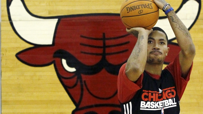 Chicago Bulls' Derrick Rose shoots during an NBA basketball practice at the team training facility, Friday, Dec. 9, 2011, in Deerfield, Ill. (AP Photo/Charles Rex Arbogast)