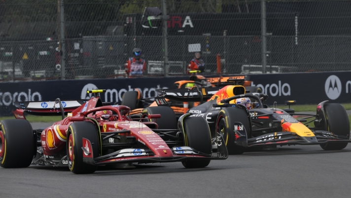 Carlos Sainz, of Spain, steers his Ferrari followed by Red Bull driver Max Verstappen of the Netherlands during the Formula One Mexico Grand Prix auto race at the Hermanos Rodriguez racetrack in Mexico City, Sunday, Oct. 27, 2024. (AP Photo/Moises Castillo)